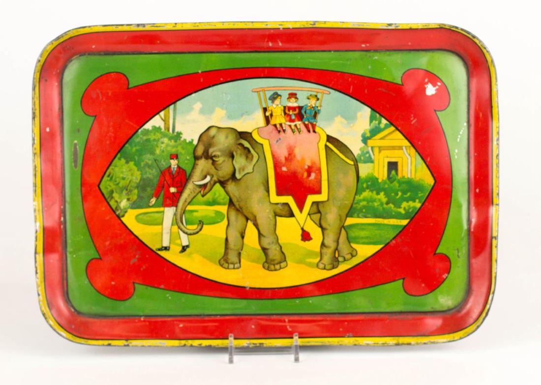 TIN LITHO CHILD'S TRAY WITH AN ELEPHANT TRAINER (1 of 2)