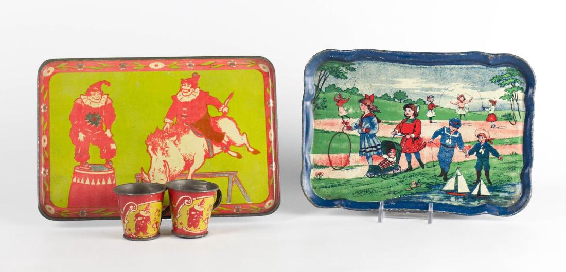 A TIN LITHO CHILD'S TEA SET PLUS ANOTHER TRAY (1 of 6)