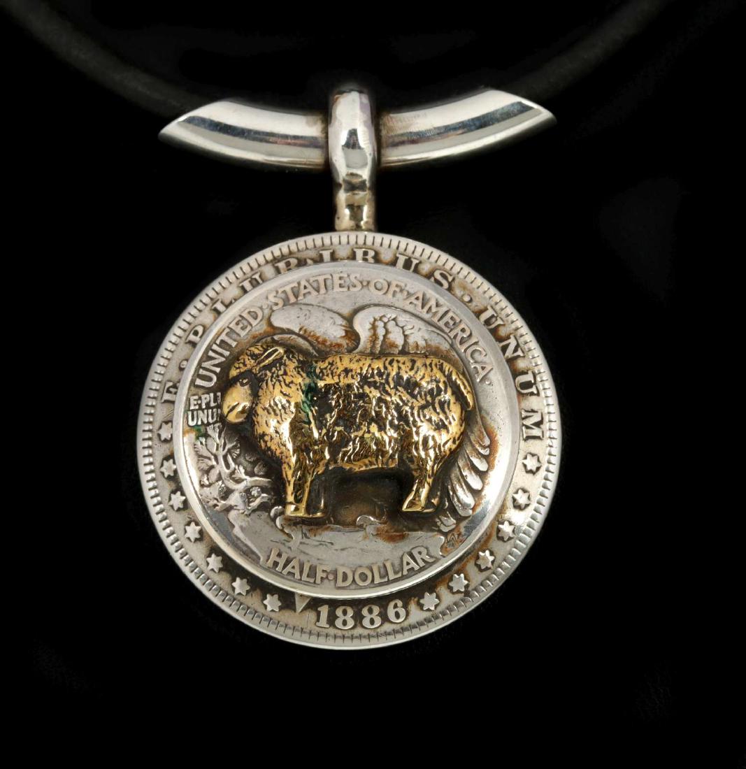 AN ARNOLD GOLDSTEIN DOMED SILVER DOLLAR PENDANT (1 of 9)