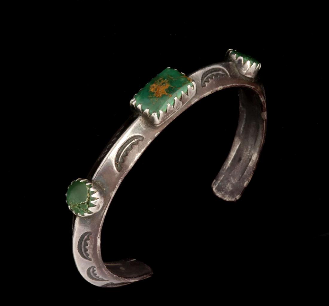 A NAVAJO STERLING BRACELET SIGNED 'J. SUINA' (1 of 8)