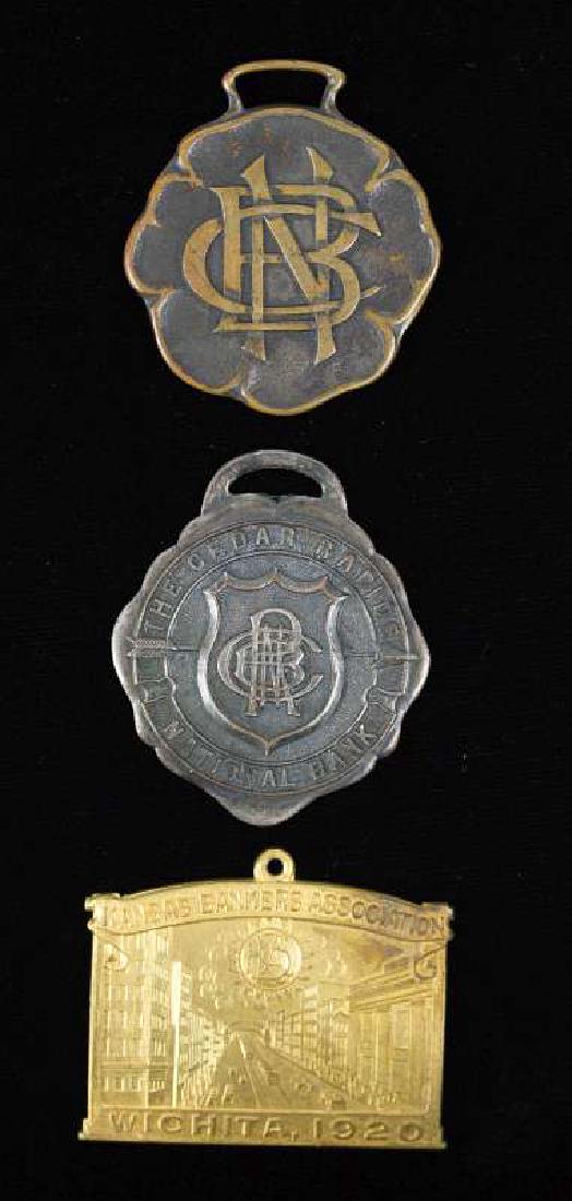 THREE BANKING RELATED ADVERTISING WATCH FOBS (1 of 2)