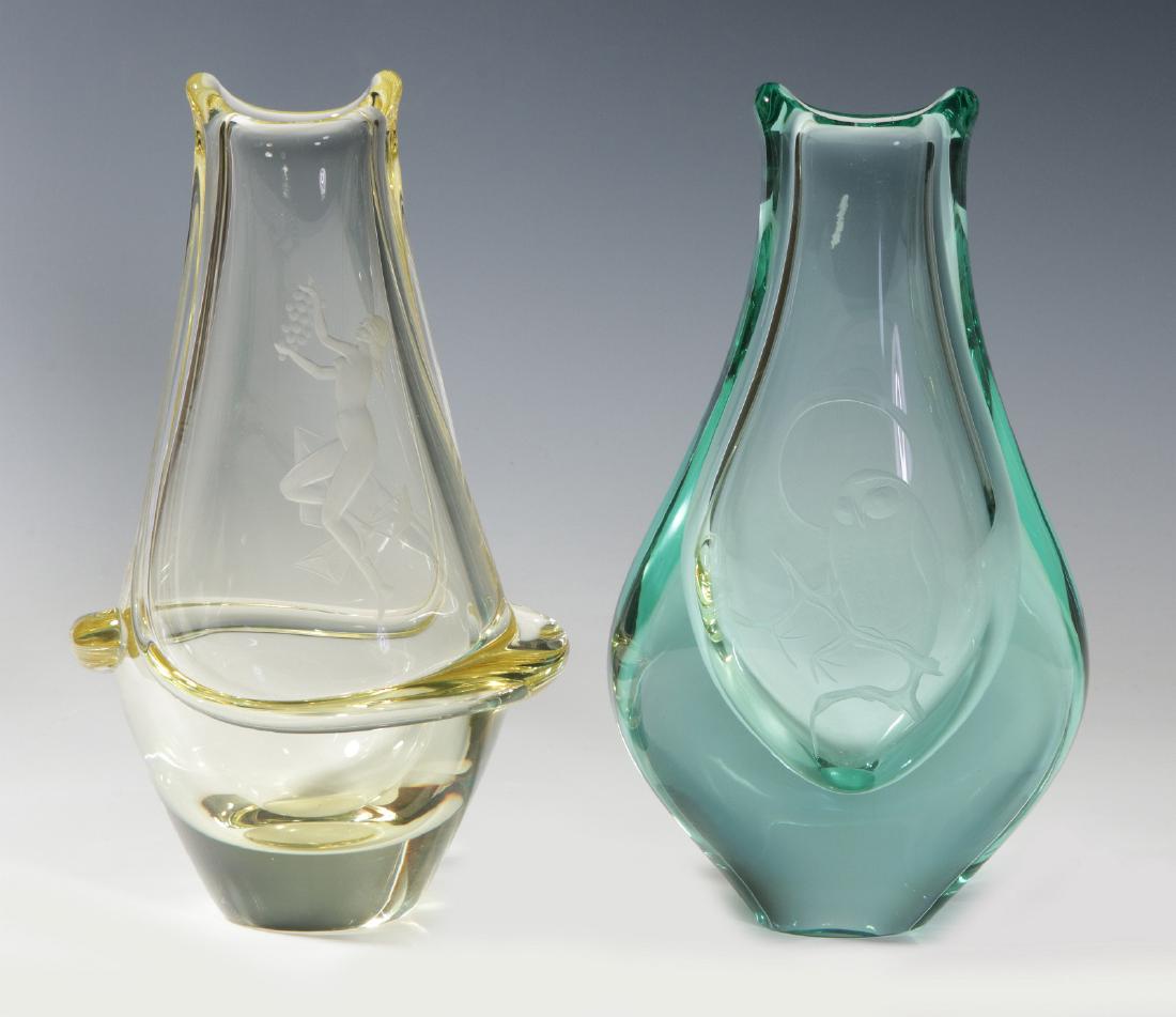 TWO WORKS OF SCANDINAVIAN ART GLASS: Etched decoration on free from vases. Measure 8 x 5 inches each. We happily provide seamless in-house packing and shipping services on nearly everything we sell.