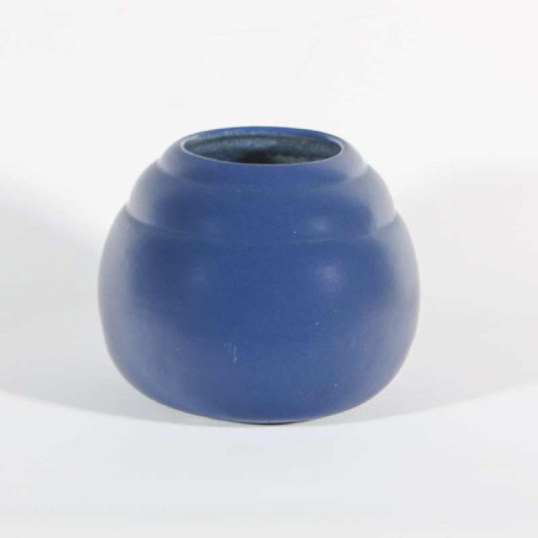 AN UNUSUALLY LARGE FT. HAYS STATE ART POTTERY VASE: Deep blue vase with base marked 'Fort Hays Kansas State College,' with other symbols around the perimeter, as shown. Measures 6.25 x 7 inches. We happily provide seamless in-house packing and shipping