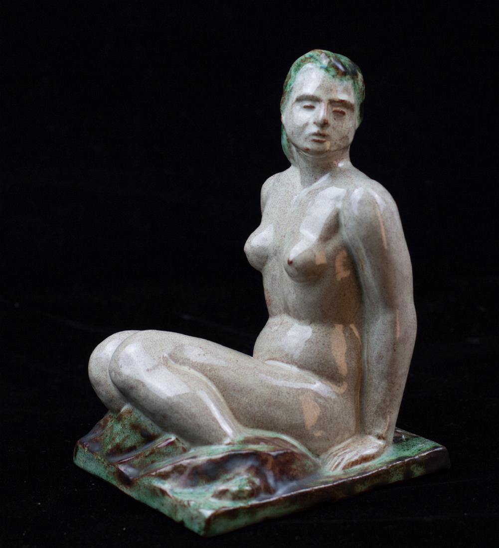 AN ART MODERNE TERRA COTTA SEATED NUDE: Scratched monogram 'PB' under the base. Measure 7.5 x 4.5 x 5.25 inches We happily provide seamless in-house packing and shipping services on nearly everything we sell.