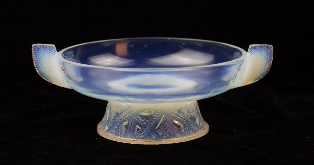 PIERRE D'AVESN (1901-1990) ART DECO OPALESCENT BOWL: A French opalescent glass bowl with a footed base and two handles, embossed signature under the base for Pierre d'AVESN (1901-1990). Measures 10 x 7.75 inches We happily provide seamless in-house pack