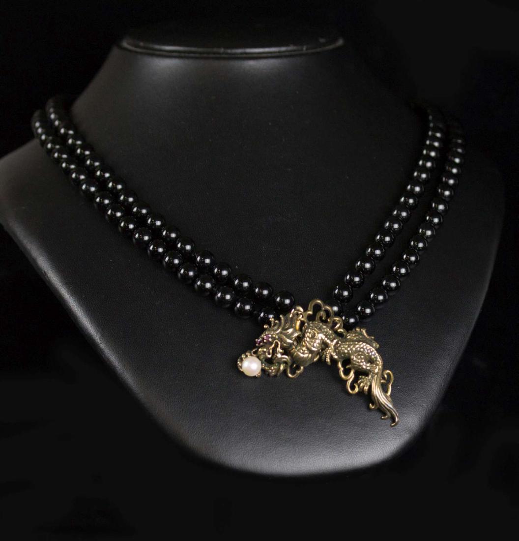 A VERMEIL FIGURAL DRAGON PENDANT ON ONYX BEADS (1 of 6)