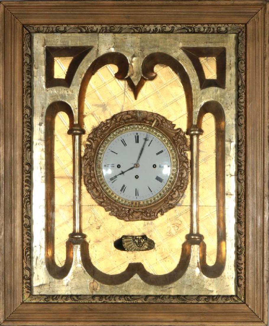 AN EARLY 19THC. GRAND SONNERIE PICTURE FRAME CLOCK: A gilt-wood picture frame hanging clock, unsigned brass plate movement, sunburst pendulum, original interior gilding, later hinged frame door, porcelain enamel dial with Roman numerals, original unsig