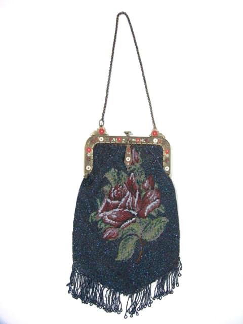 ANTIQUE BEADED PURSE W/ENAMELED FRAME: Measures 11 inches long with fringe but without the chain and 5 inches wide at the enamel frame. Original lining, tight clasp in good condition