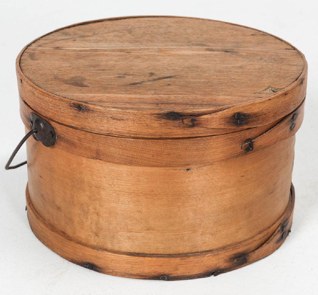 A CIRCA 1900 BENTWOOD PANTRY BOX WITH BAIL HANDLE: Tack construction. Measures 5.5 X 9 inches. We happily provide seamless in-house packing and shipping services on nearly everything we sell.