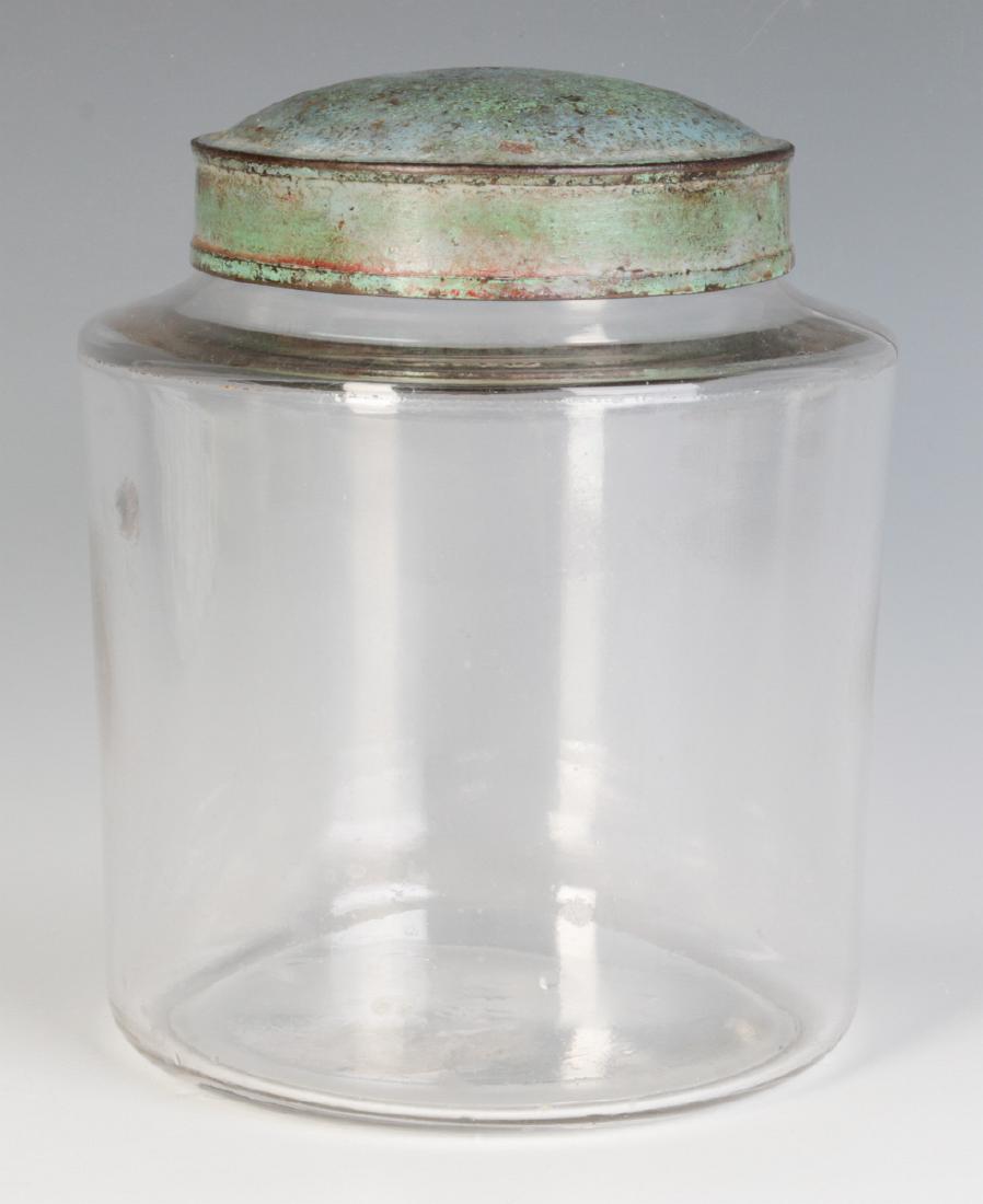 AN EARLY BLOWN GLASS STORAGE JAR WITH TOLE LID (1 of 7)