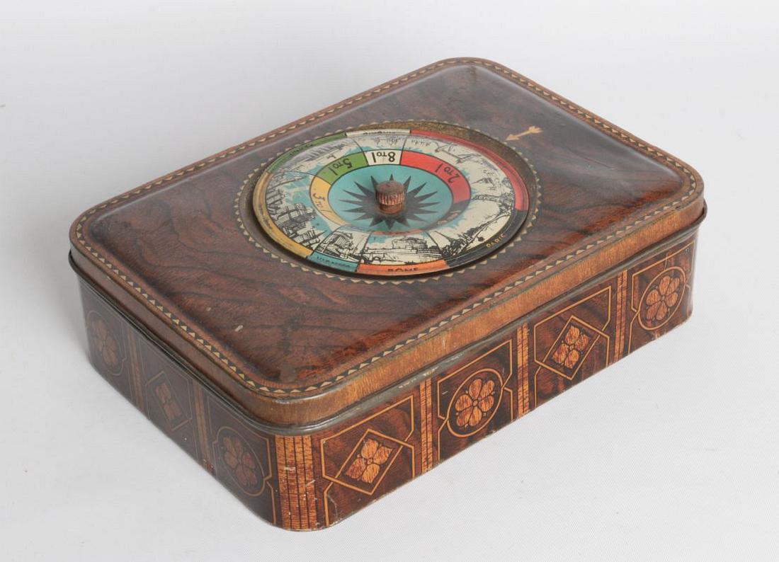 A TIN LITHO BISCUIT TIN W/ SPINNING ROULETTE GAME (1 of 4)