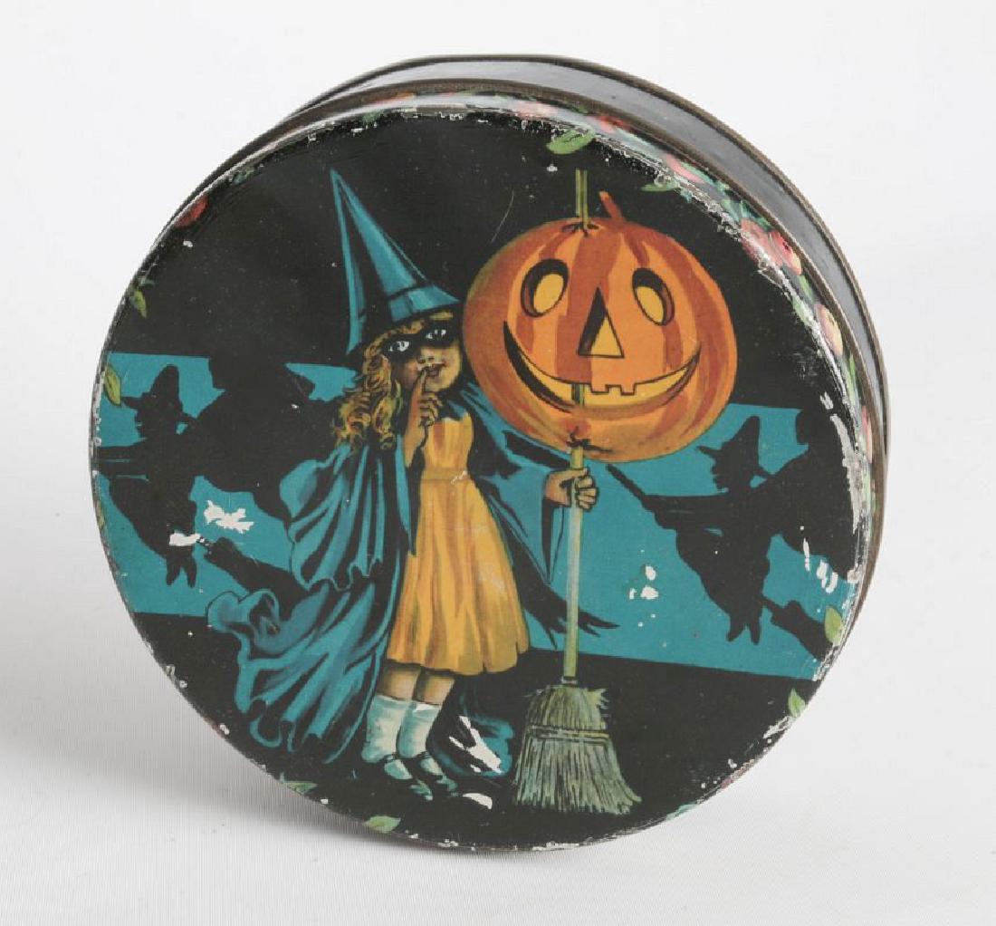 A HALLOWEEN THEME TIN LITHO BISCUIT TIN: Stamped 'Tindeco' on the underside. Measures 2 x 6 inches, We happily provide seamless in-house packing and shipping services on nearly everything we sell.
