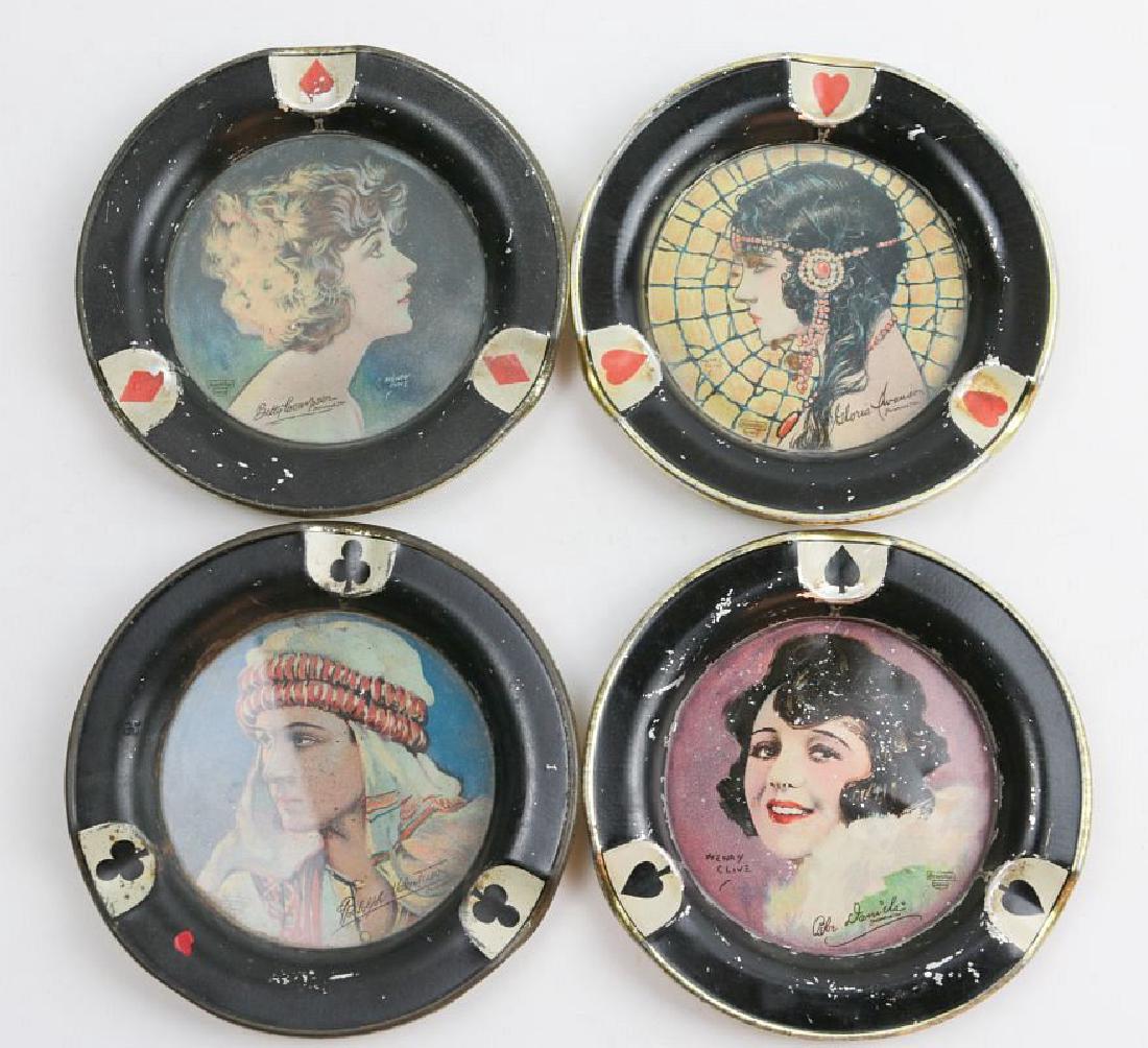 FOUR HENRY CLIVE PLAYING CARD MOTIF TRAYS W/LADIES: Each with a portrait and a card suit. Marked for Beautebox Canco. Measure 4.5 inches in diameter. We happily provide seamless in-house packing and shipping services on nearly everything we sell.