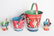 FOUR VARIED SIZE CHILD'S TIN LITHO SAND PAILS - 3