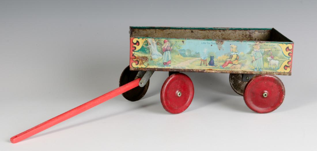 A TIN LITHO CHILD'S DOLL NURSERY RHYME WAGON (1 of 9)