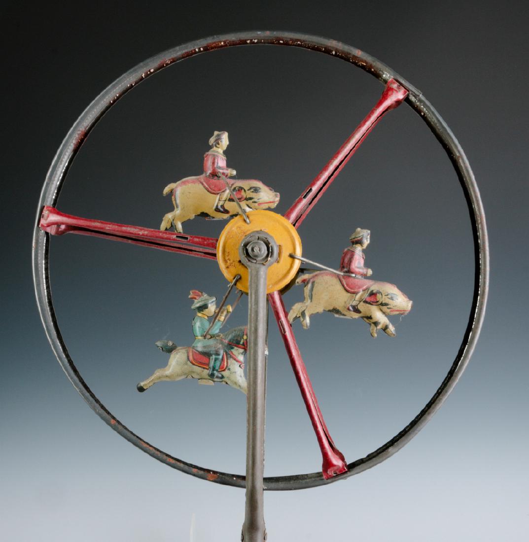 A CHILD'S TIN LITHO ROLL-A-LONG WHEEL TOY C. 1900 (1 of 6)