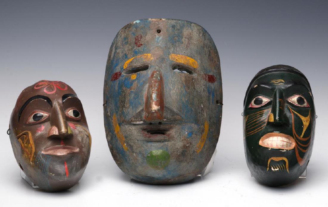 A COLLECTION OF SOUTH AMERICAN CARVED WOOD MASKS (1 of 9)
