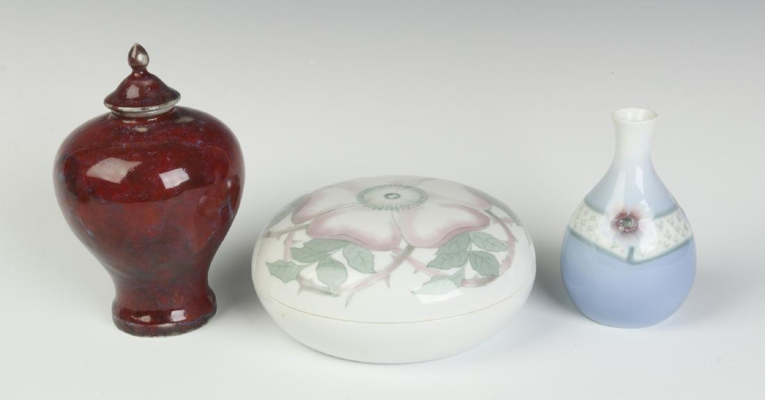 THREE RORSTRAND PORCELAIN PIECES: Two covered pieces and a vase. Smallest to largest measures 4.5 x 2.5 inches to 2.75 x 6.25 inches. We happily provide seamless in-house packing and shipping services on nearly everything we sell.