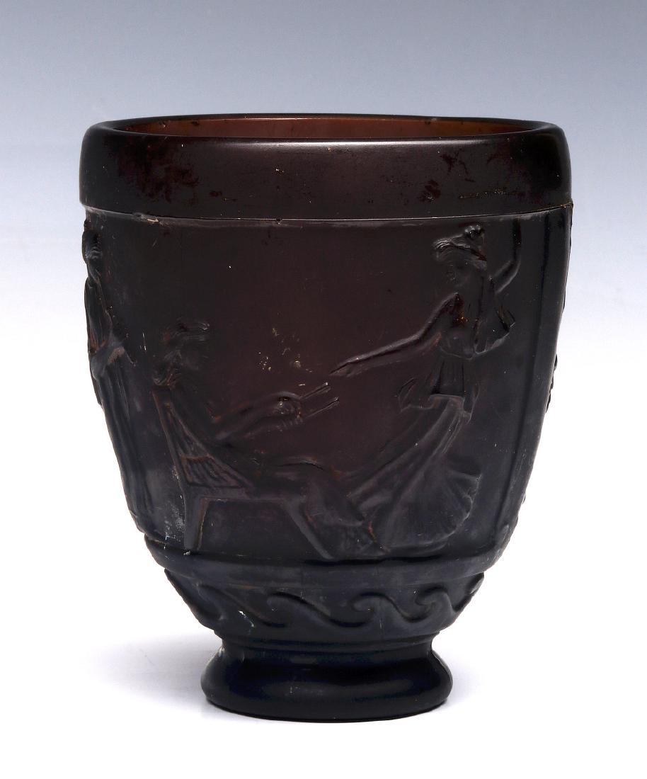 GEORGE DE FEURE (1868-1943) FRENCH GLASS VASE: Frosted amethyst glass vase molded with classical musicians and dancers, signed under the base. Measures 5.5 x 4.75 inches. We happily provide seamless in-house packing and shipping services on nearly