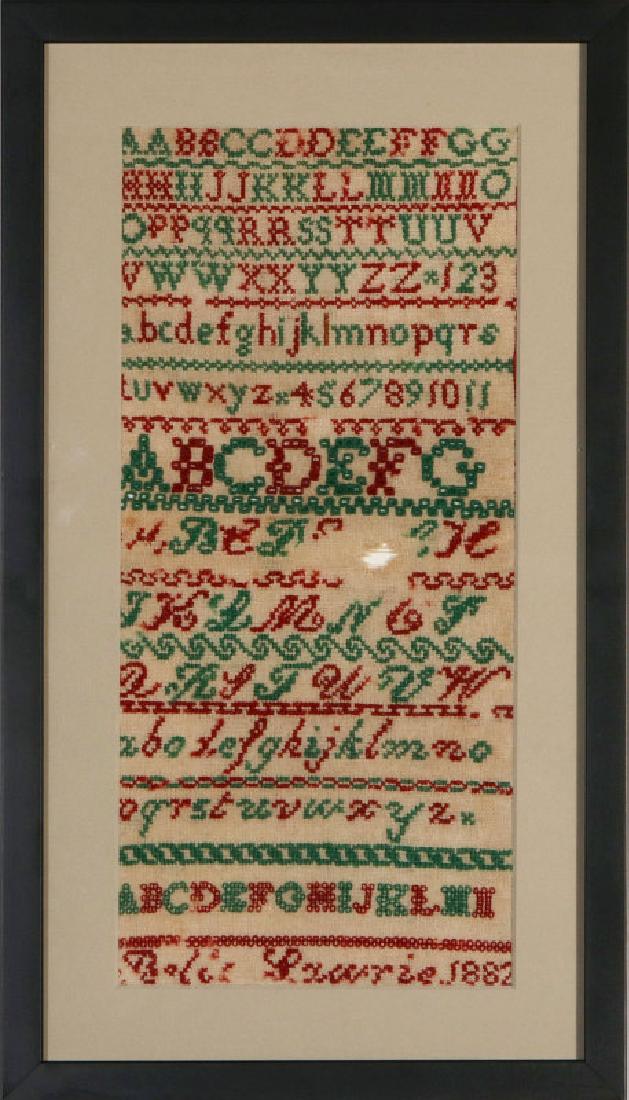 A TWO-COLOR CROSS STITCH SAMPLER DATED 1882 (1 of 7)
