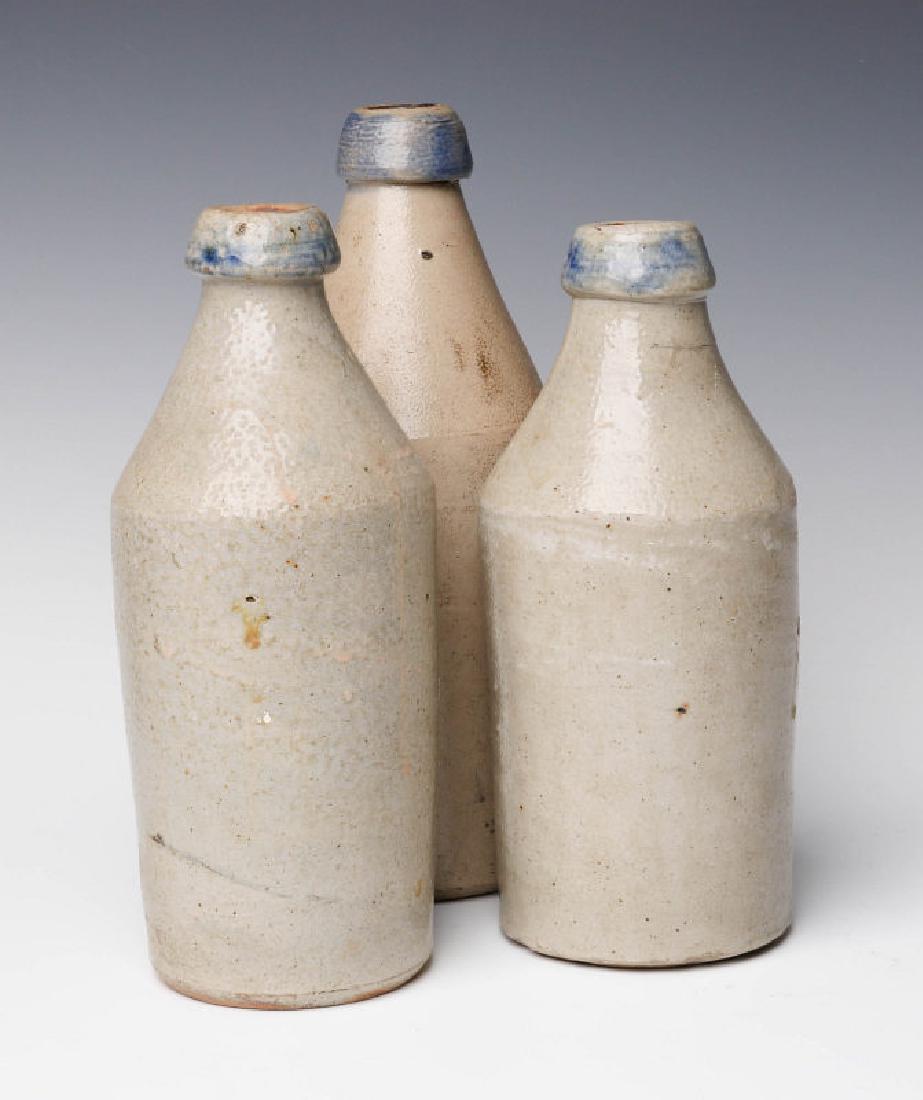 THREE 19TH C. BLUE DECORATED STONEWARE BOTTLES (1 of 7)
