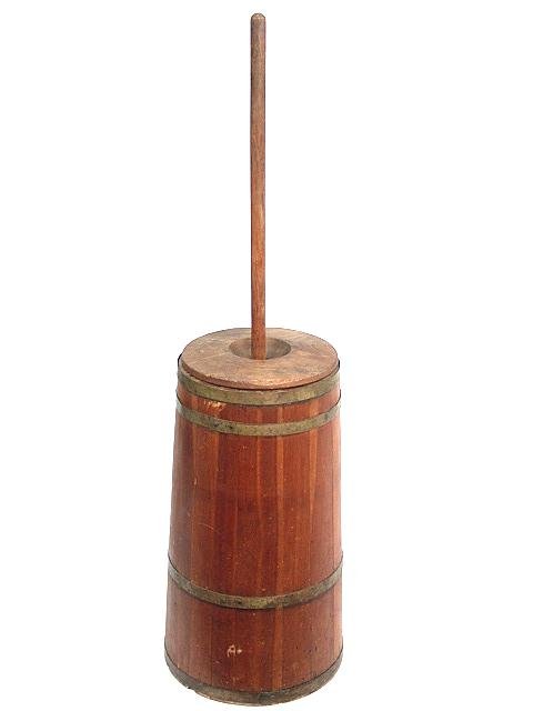 19TH CENTURY AMERICAN CHERRY CHURN: American cherry churn has brass hoops and measures 21 1/2" tall by 12" wide. Dasher measures 40" tall by 9 1/2" wide. One section of dasher looks to have been re-glued, otherwise it and the churn are