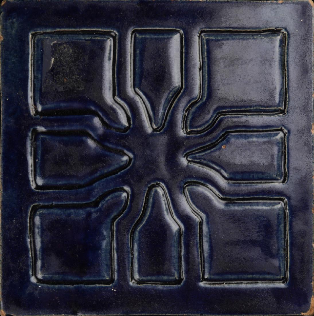 A 1924 CARVED AND GLAZED TILE SIGNED RUTH DUNHAM: Ruth Dunham (20th Century) 1924 Dated 1924, decorated with an incised geometric design, signed 'Ruth Dunham 24' verso. Measures 5.5 inches. We happily provide seamless in-house packing and shipping se