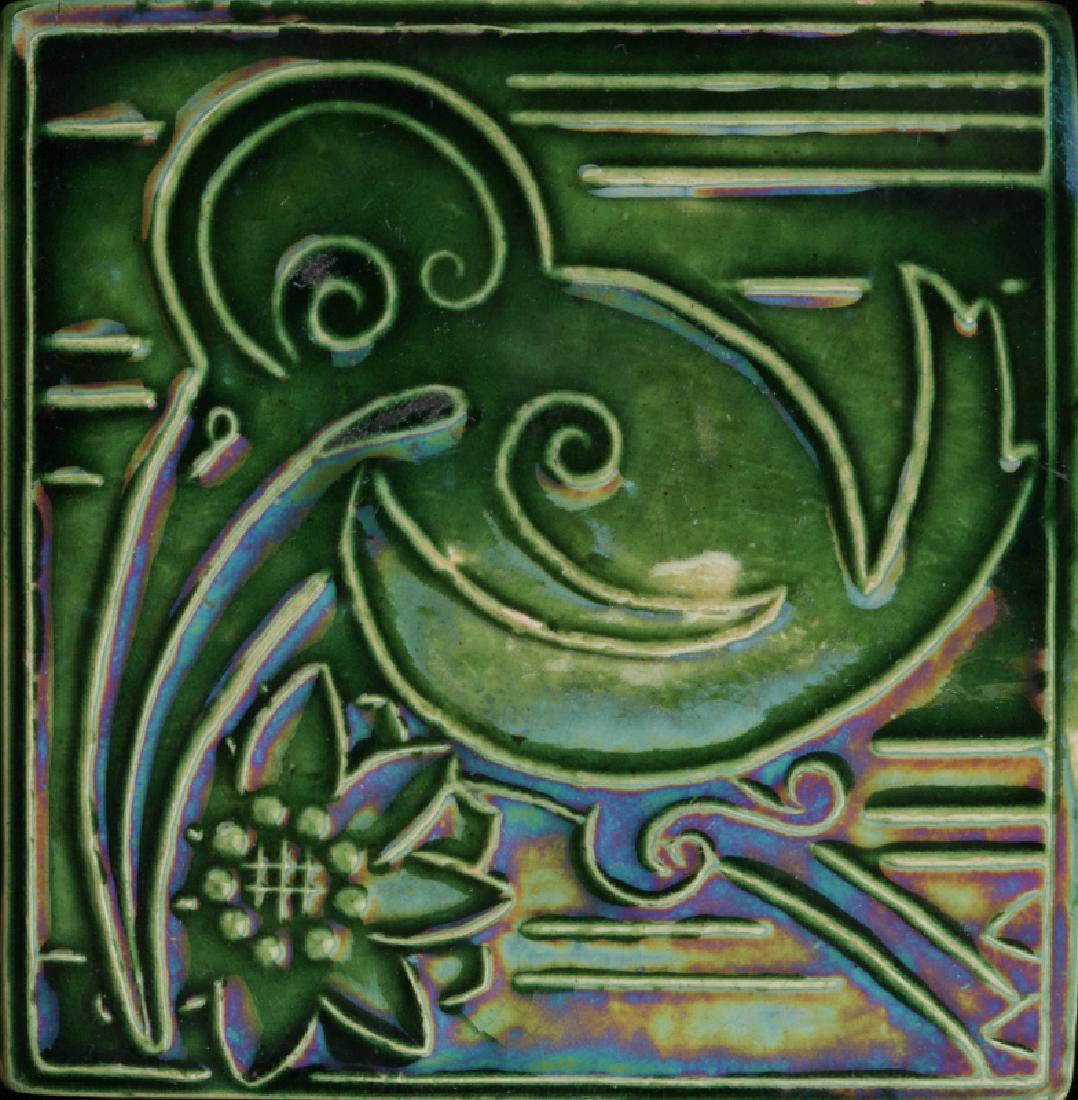AN EARLY 20TH CENTURY PIPING DECORATED ART TILE (1 of 4)