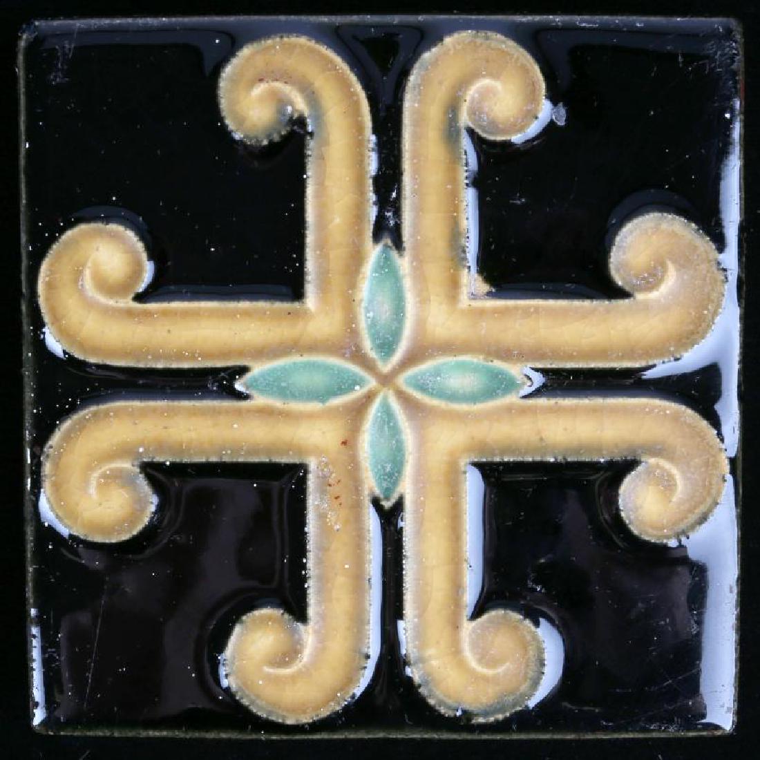 AN ARCHITECTURAL TILE WITH STYLIZED MALTESE CROSS: An interesting architectural tile, circa early 20th century, unsigned. Measures 4 x 4. We happily provide seamless in-house packing and shipping services on nearly everything we sell.