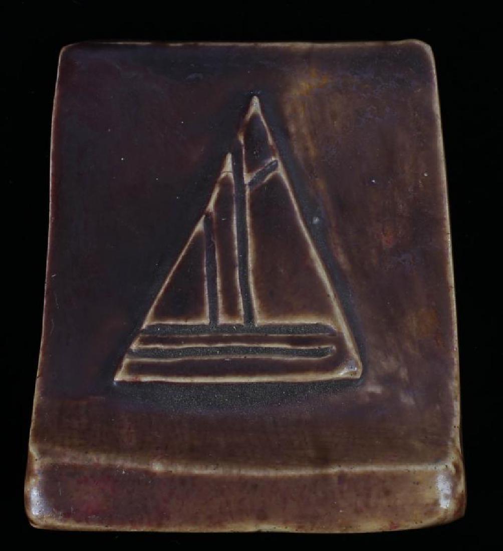 AN EARLY 20TH C. ART TILE WITH CARVED SAILBOAT (1 of 2)