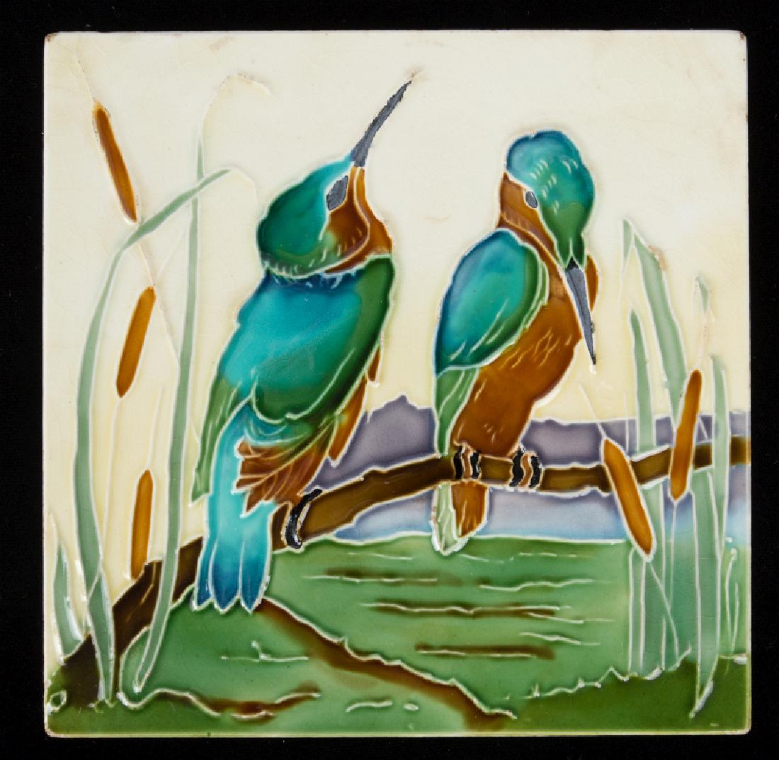 AN ENGLISH MAJOLICA GLAZE TRIVET: The footed tile with tube-lined decoration of water birds and polychrome glazes. Measures 6 inches. We happily provide seamless in-house packing and shipping services on nearly everything we sell.