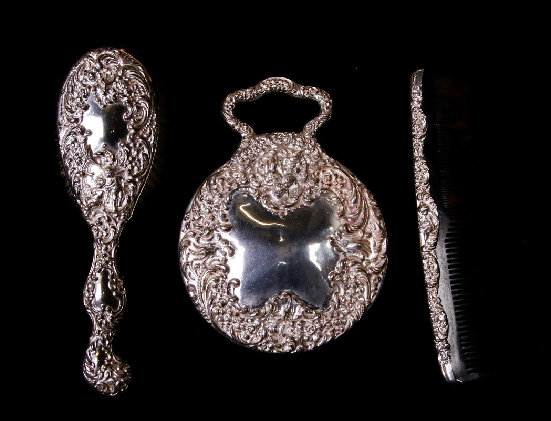 A HIGHLY EMBOSSED UNGER BROS STERLING DRESSER SET (1 of 5)