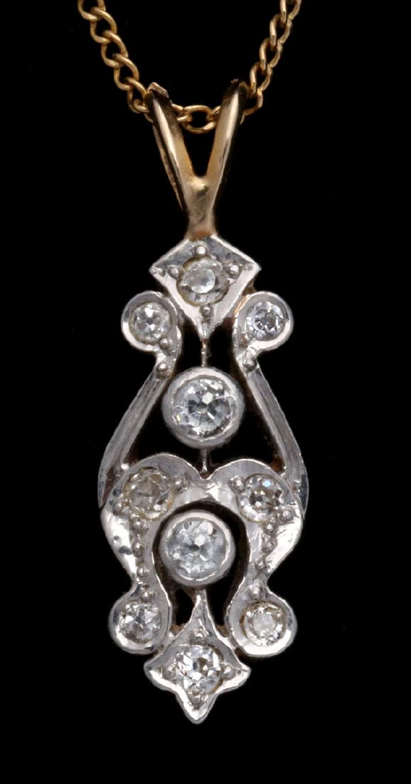 AN ANTIQUE 14K GOLD AND DIAMOND PENDANT (1 of 6)