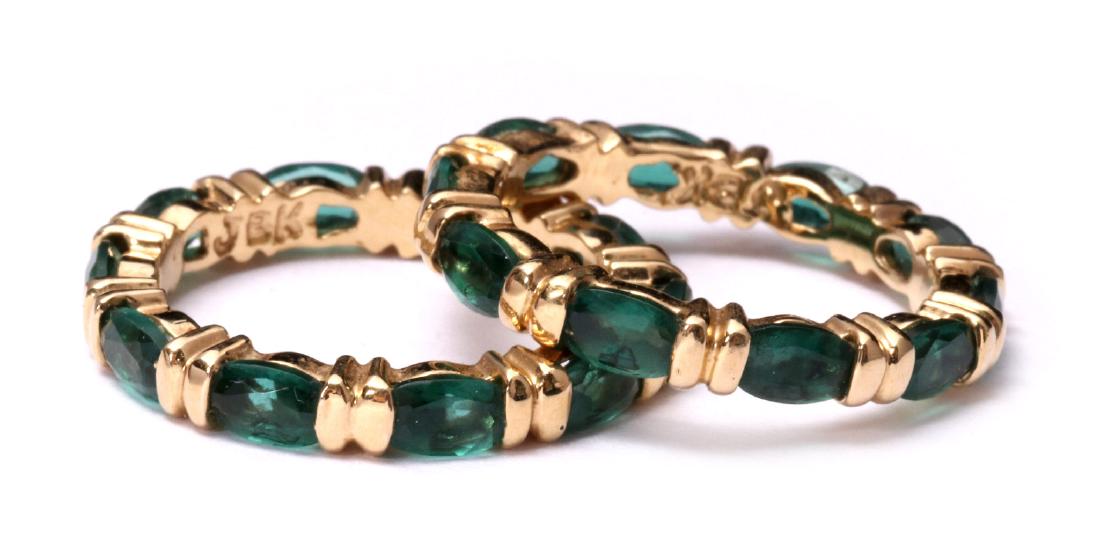 JAQUELINE KENNEDY VERMEIL AND FAUX PERIDOT RINGS: A pair of matching vermeil rings each set with ten 4 x 3 mm oval faceted green gems, signed JBK and marked 925 inside the bands. Rings size 6, total weight .17 ozt. We happily provide seamless in-hous