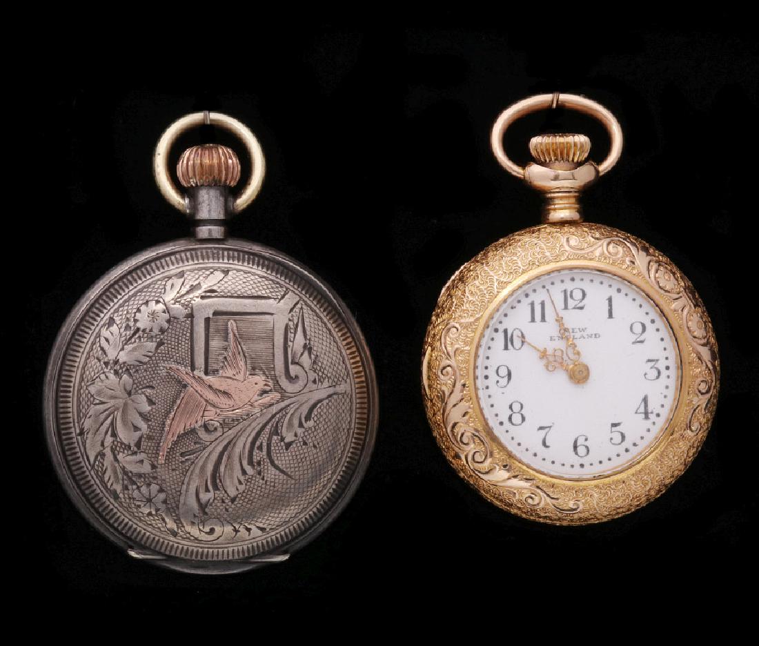 TWO ANTIQUE LADIES WATCHES: The silver model stamped with .800 Swiss silver grouse hallmark, the other ornate gold-filled. Measures 1.75 inches each with the stems. We happily provide seamless in-house packing and shipping servi