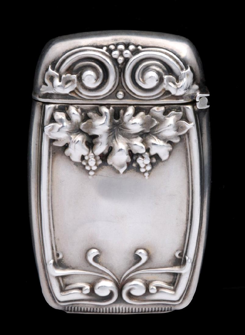 AN ANTIQUE STERLING MATCH SAFE WITH VINEYARD THEME (1 of 11)