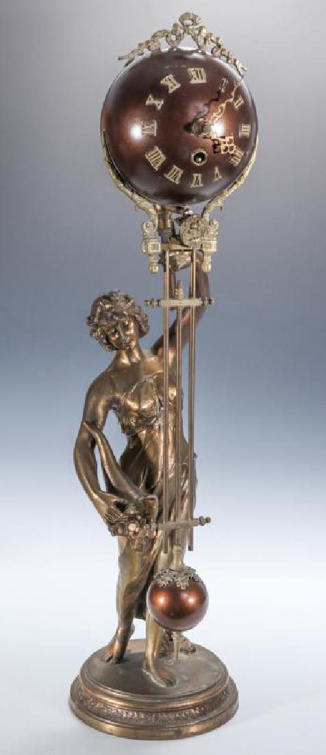 AN EARLY 20TH CENTURY SWINGER STATUE BALL CLOCK (1 of 13)