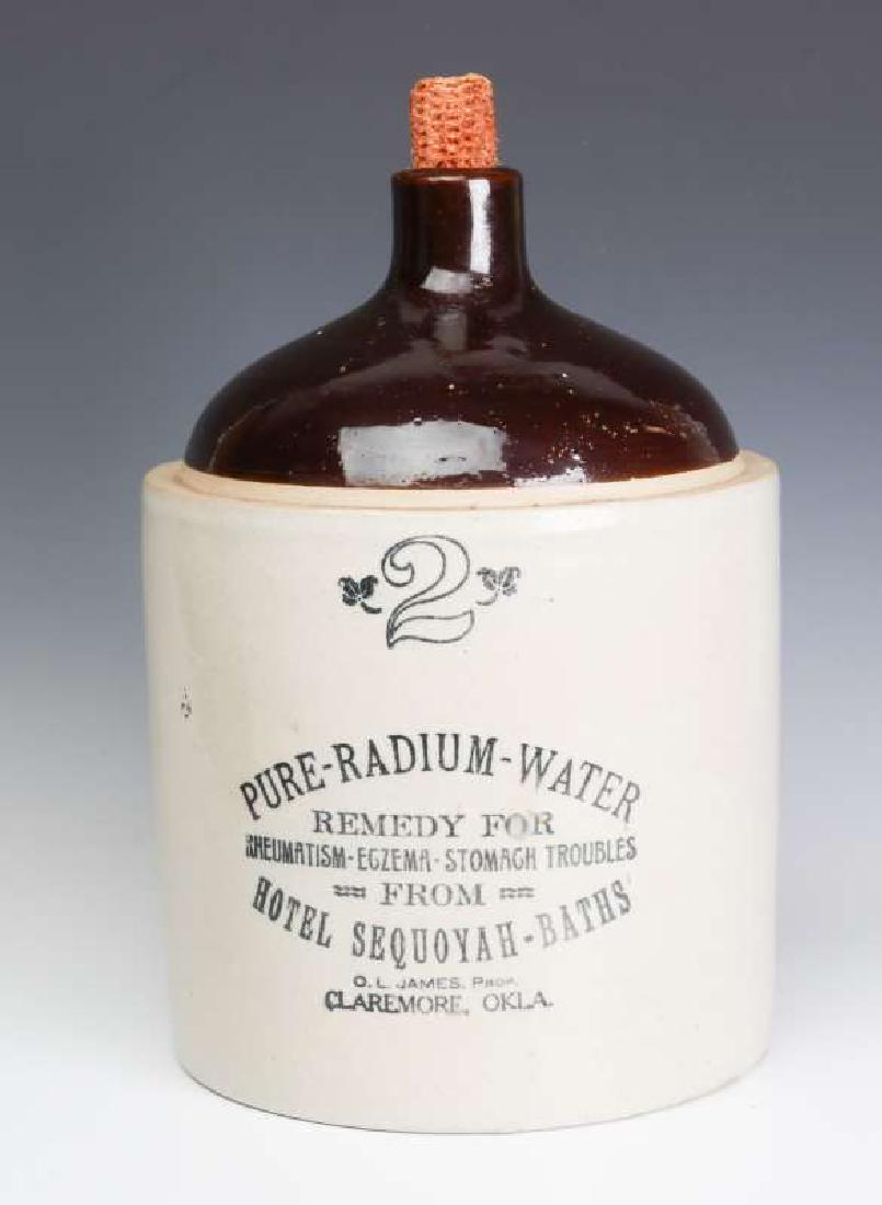 A SCARCE RADIUM WATER HOTEL SEQUOYAH ADVTG JUG: A brown cone top over bristol glaze with black transfer advertising PURE-RADIUM-WATER Remedy For Rheumatism - Eczema-Stomach Troubles From HOTEL SEQUOYAH - BATHS O.L. JAMES Prop. Claremore Okla. Unsig