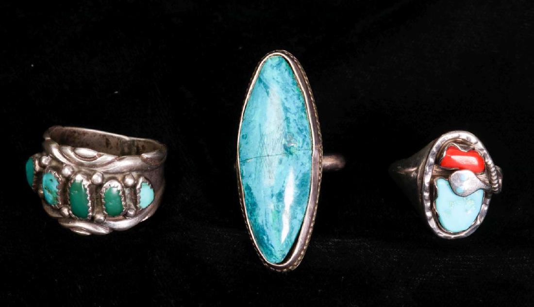 A COLLECTION OF NAVAJO AND ZUNI JEWELRY: An Effie Calavaza (20th/21st century, Zuni) signature snake ring with turquoise and coral, signed on the back 'Effie C' and marked Zuni, presumably a product of the Effie C mother/daughter workshop. W