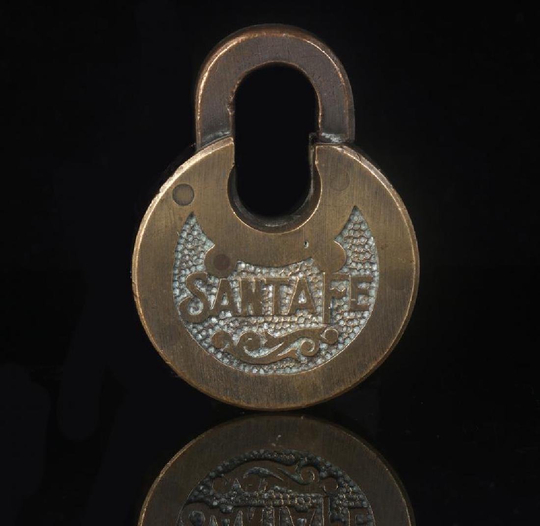 A BRASS SANTA FE PANCAKE PADLOCK (1 of 8)