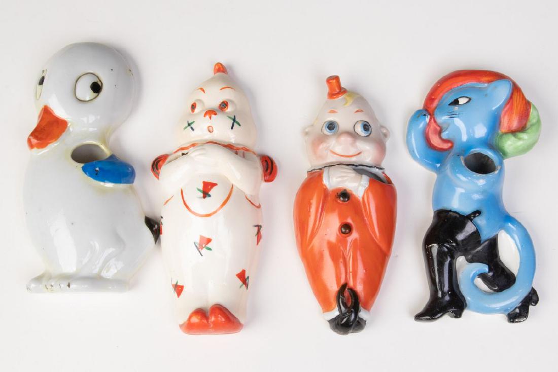 FOUR GOOD GERMAN AND JAPANESE TOOTHBRUSH HOLDERS (1 of 6)