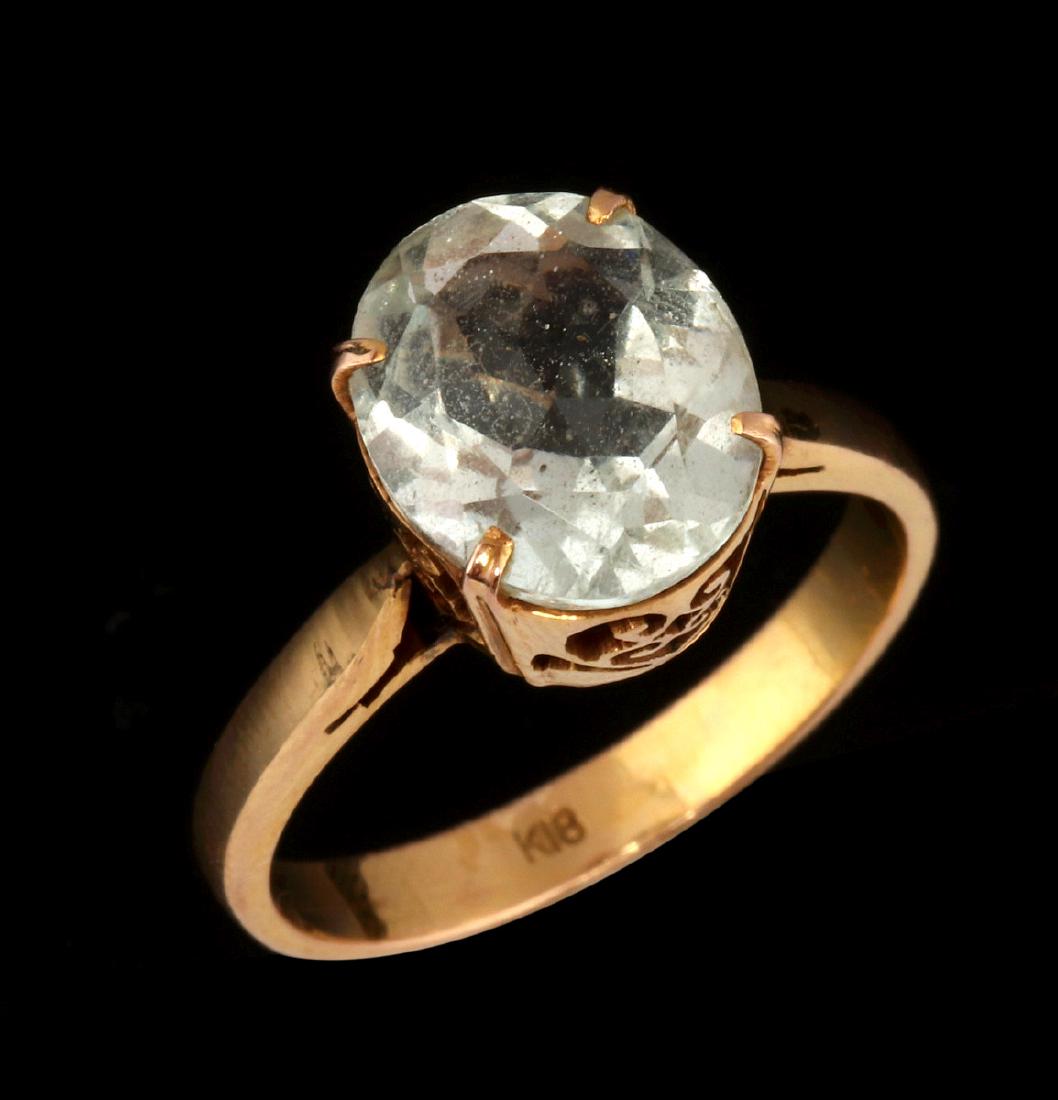 AN 18K GOLD AND NEAR COLORLESS TOURMALINE RING (1 of 6)