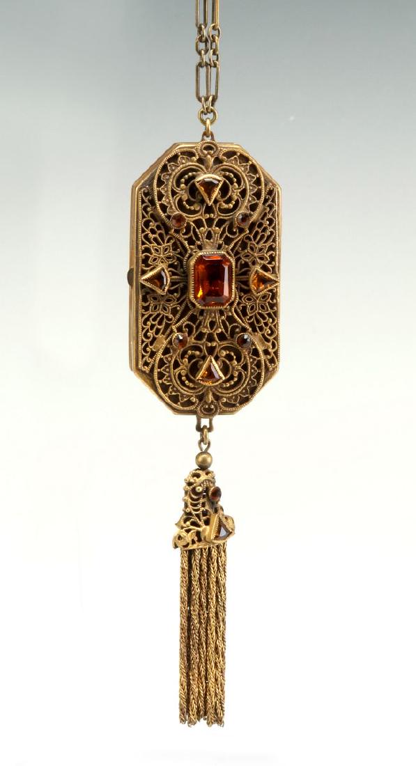 AN ANTIQUE JEWELED BRASS FILIGREE COMPACT (1 of 8)