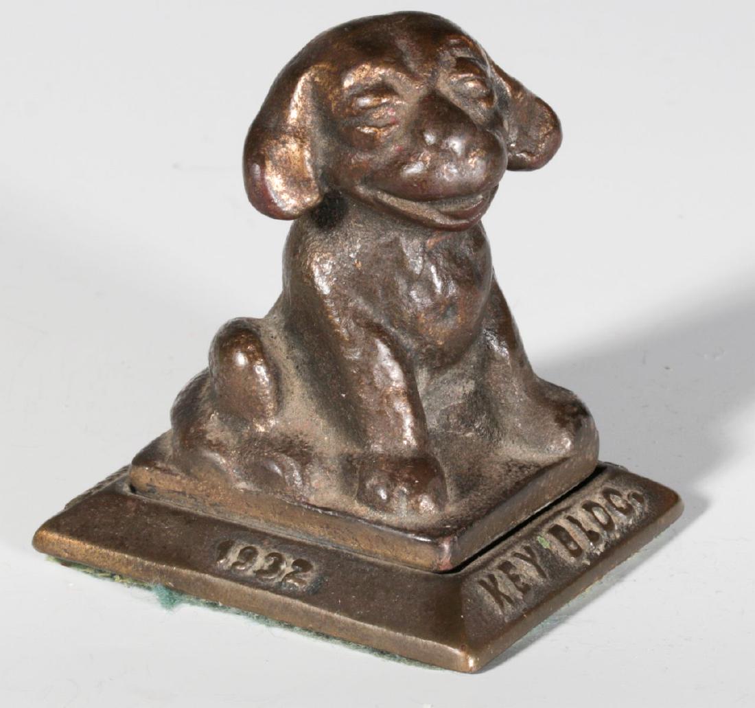 A 1932 FIGURAL DOG ADVERTISING PAPERWEIGHT (1 of 6)