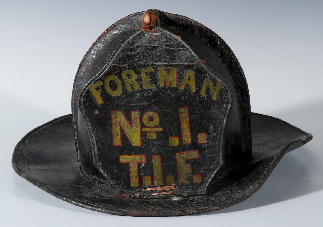 AN EARLY FOREMAN LEATHER FIRE HELMET (1 of 16)