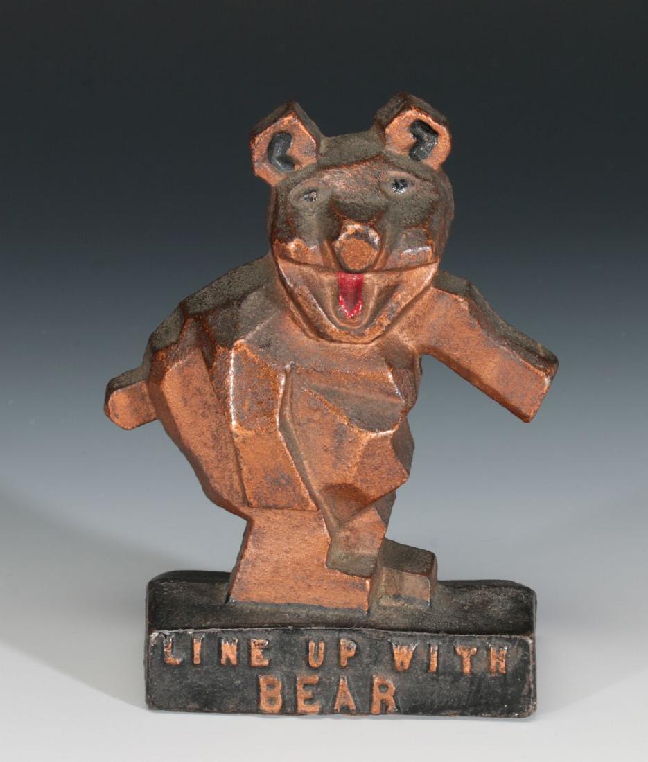 A 1920s 'LINE UP WITH BEAR' ADVERTISING PAPERWEIGHT (1 of 6)