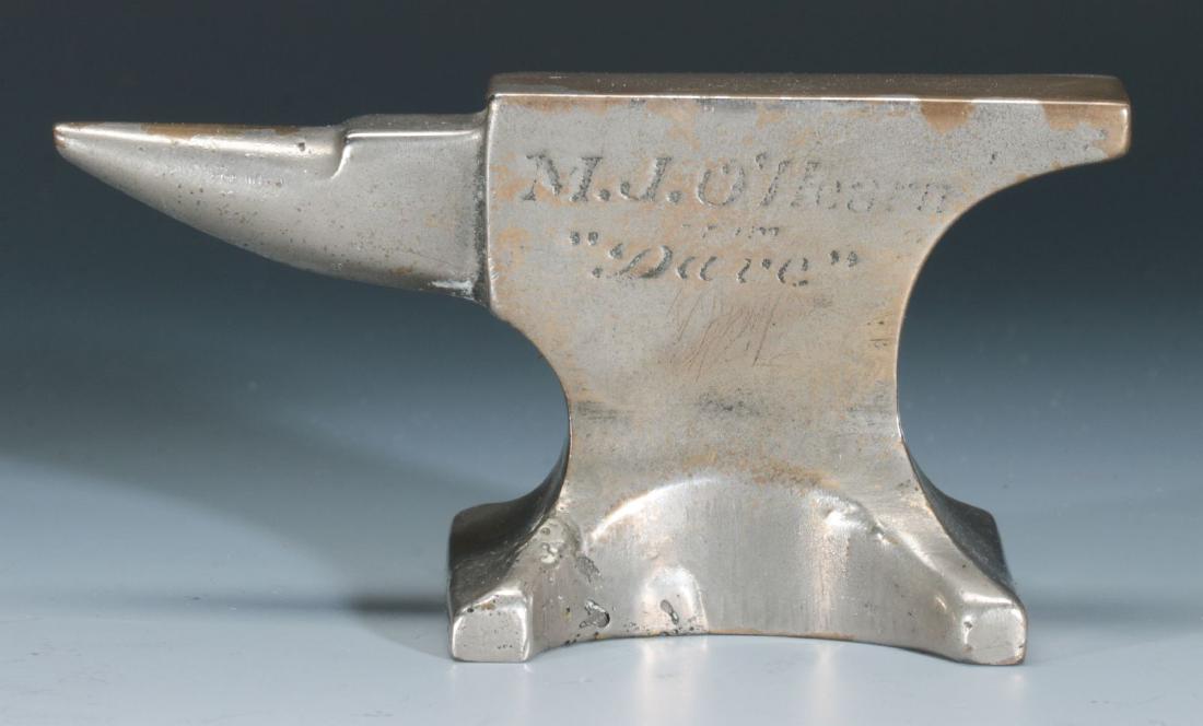 AN ANTIQUE MINIATURE ANVIL ADVERTISING PAPERWEIGHT (1 of 6)