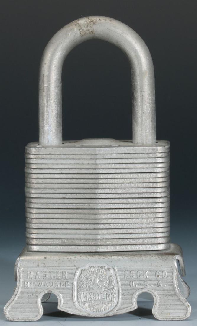 A FIGURAL MASTER LOCK CO. ADVERTISING PAPERWEIGHT (1 of 7)