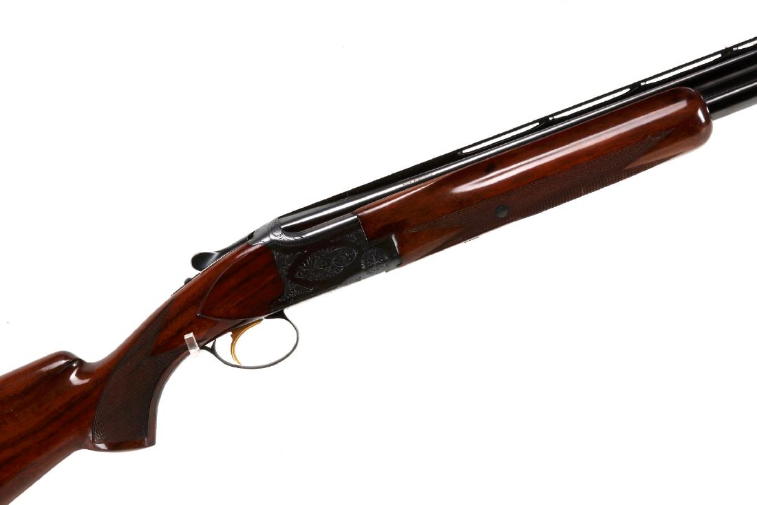 BELGIUM/BROWNING LIGHTNING SUPERPOSED 12GA O/U: Belgium/Browning 12 Gauge Lightning (serial #:86531) The 32-inch ventilated rib barrels with good blue finish, checkered deluxe wood stocks with hard rubber butt pad, excellent woods, a fine shotgun. 