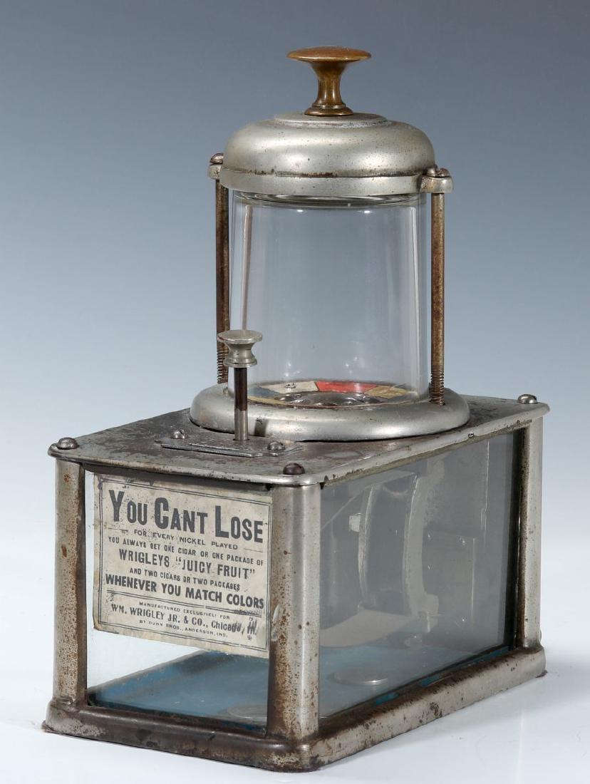 A 'CAN'T LOSE' WRIGLEY GUM NICKEL ROULETTE GAME: Manufactured circa 1905 by 'Dunn Bros., Anderson Ind', per the original placard behind the front glass, which reads 'Manufactured Exclusively For Wrigley Jr. & Co. , Chicago Ill. By Dunn Bros. Anderso